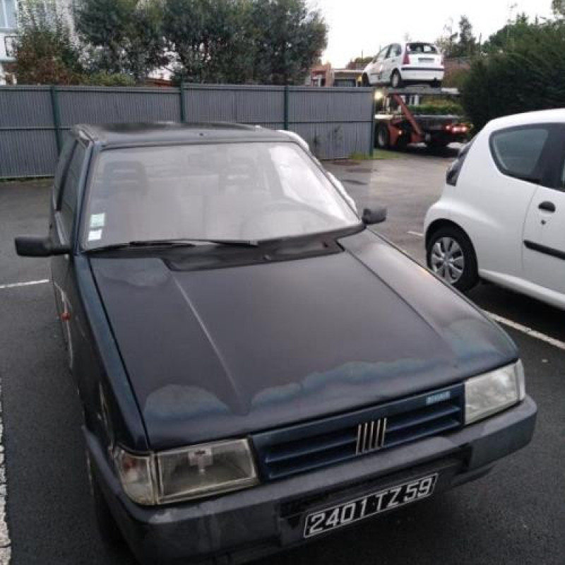 Optique avant principal gauche (feux)(phare) FIAT UNO Photo n°4