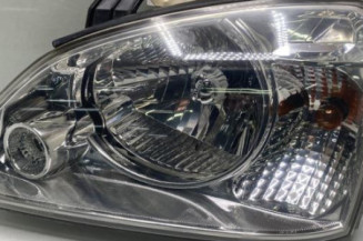 Optique avant principal gauche (feux)(phare) KIA CARENS 2 Photo n°1