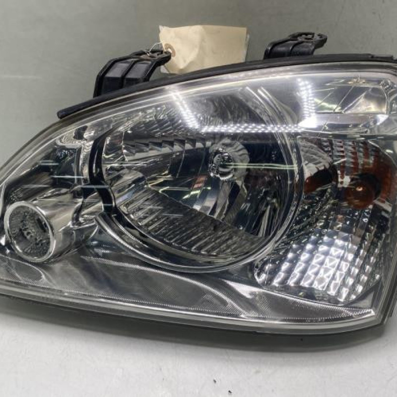 Optique avant principal gauche (feux)(phare) KIA CARENS 2 Photo n°1