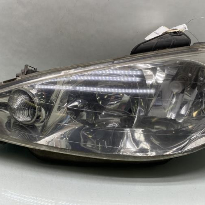 Optique avant principal gauche (feux)(phare) PEUGEOT 206 Photo n°1