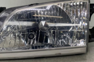 Optique avant principal gauche (feux)(phare) MAZDA DEMIO Photo n°1