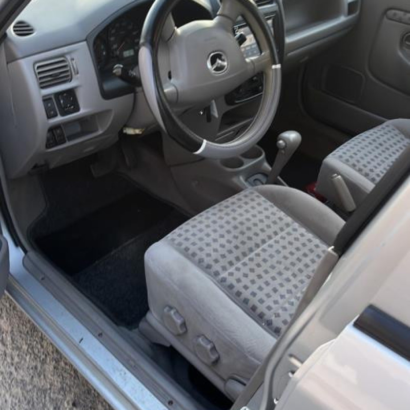 Optique avant principal gauche (feux)(phare) MAZDA DEMIO Photo n°13