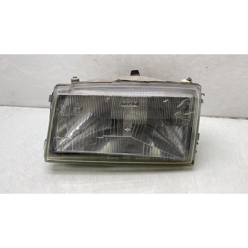 Optique avant principal gauche (feux)(phare) FIAT UNO Photo n°1