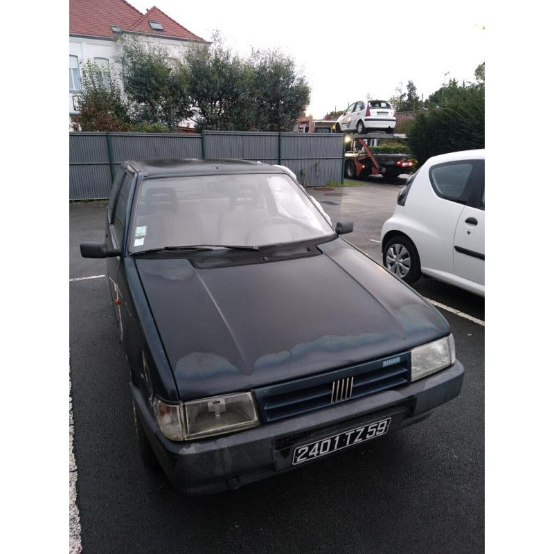 Optique avant principal gauche (feux)(phare) FIAT UNO Photo n°6